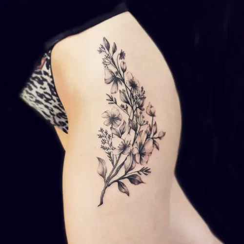 realistic flowers hip tattoo